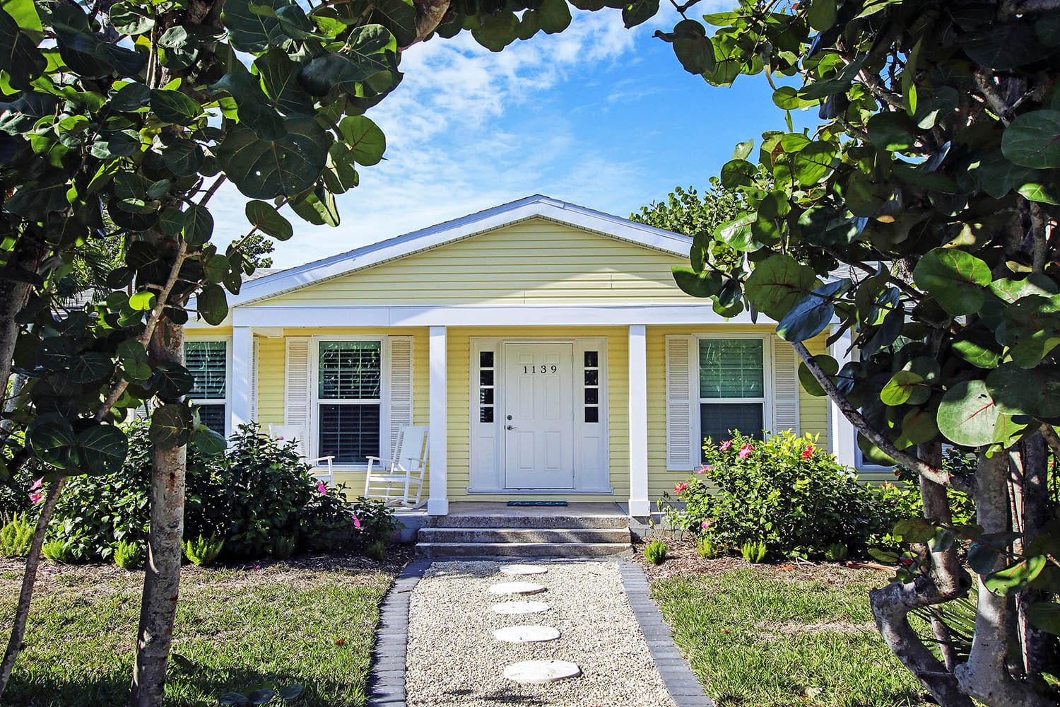 A house with a white door and a porch.