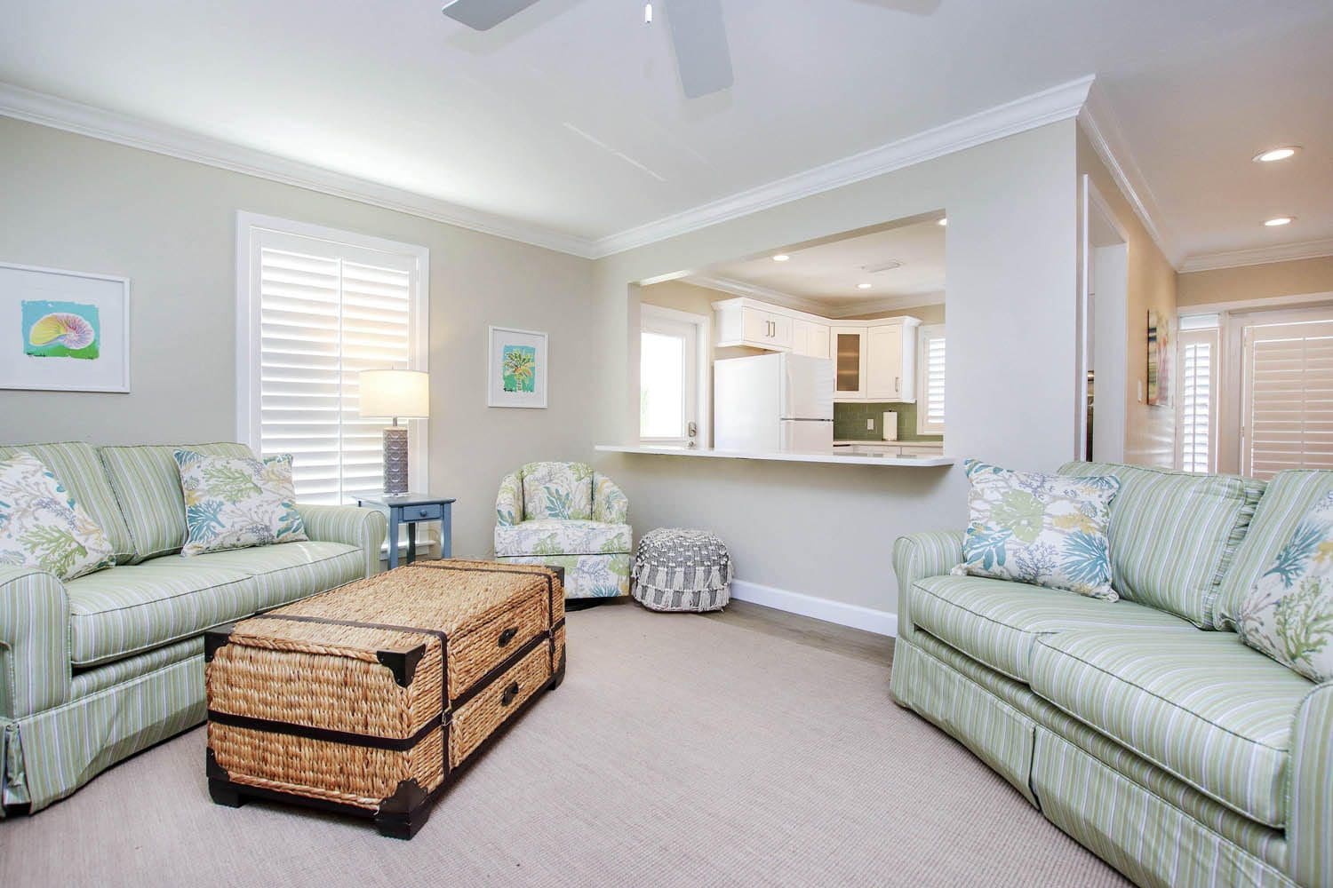 A living room with couches, chairs and tables.